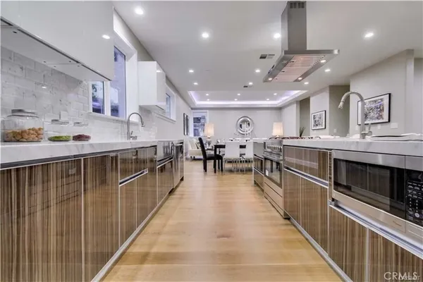 a large kitchen with stainless steel appliances granite countertop lots of counter top space