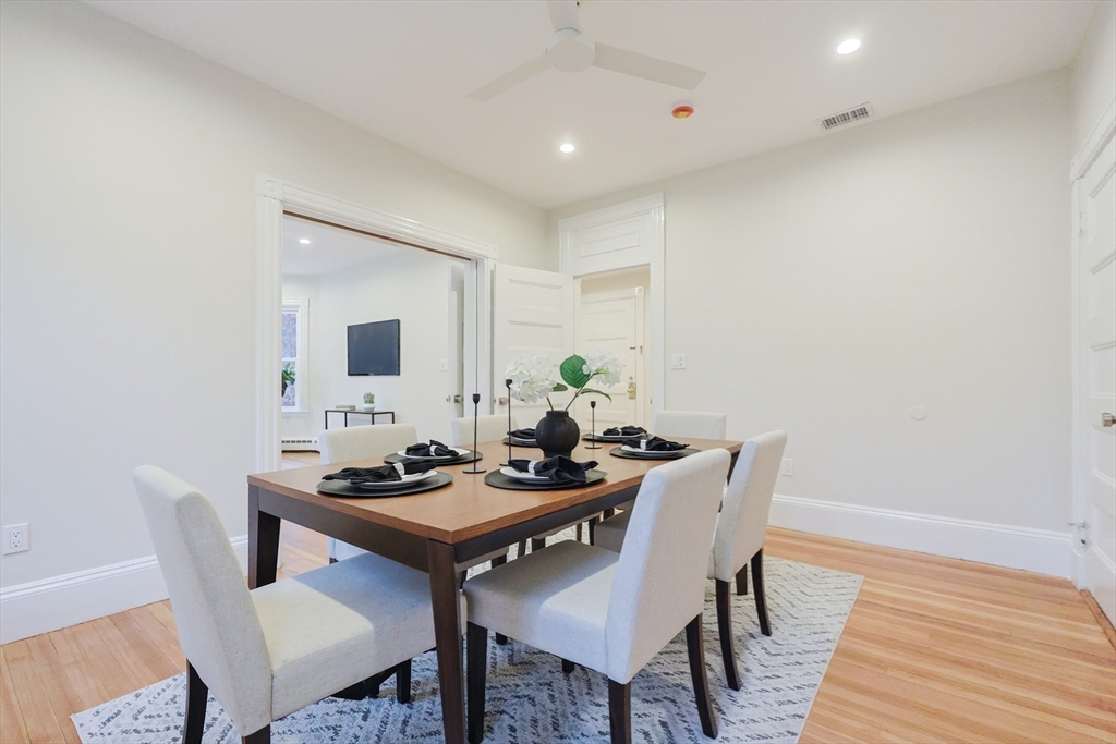 28 Inman Street, Unit 4 Cambridge, MA 02139 - Photo 12 of 32 a dining room with furniture and wooden floor
