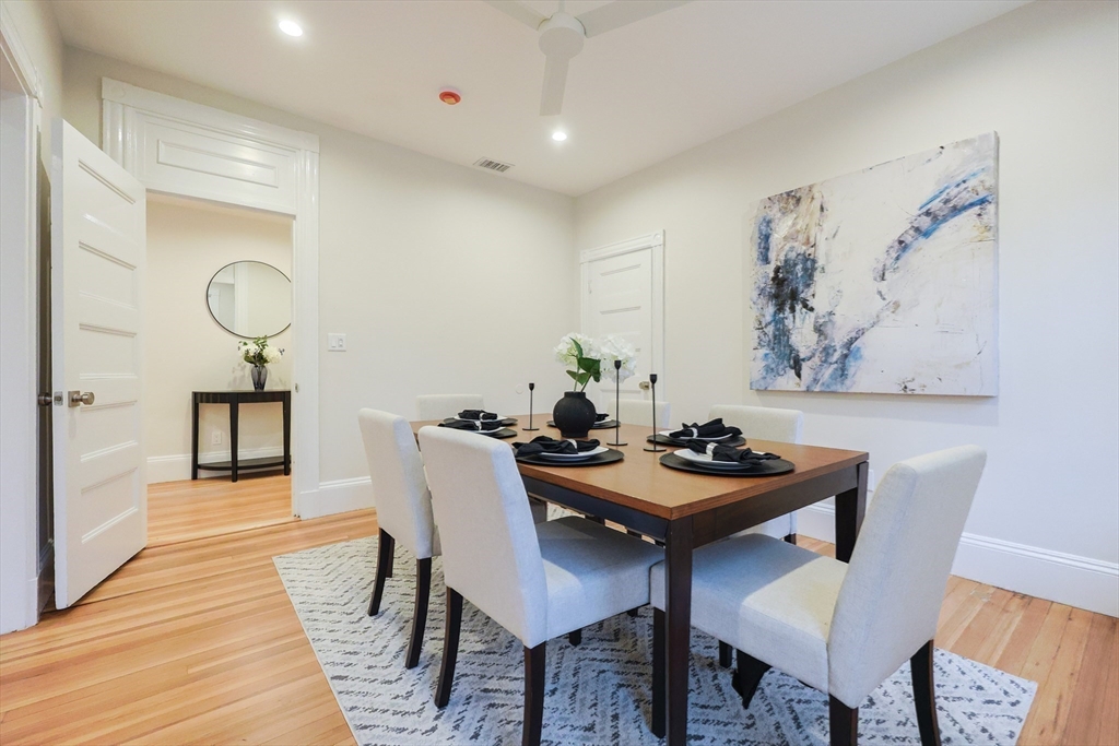 28 Inman Street, Unit 4 Cambridge, MA 02139 - Photo 13 of 32 a view of a dining room with furniture and wooden floor