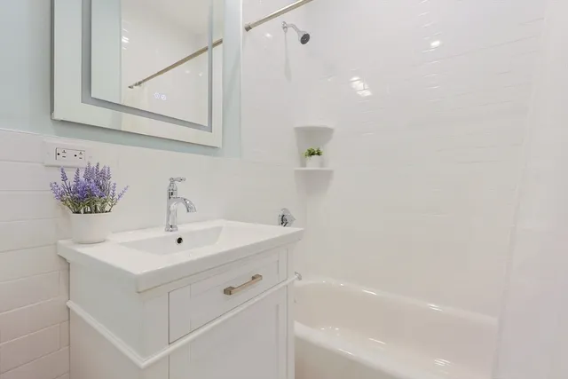 a bathroom with a sink and a bathtub
