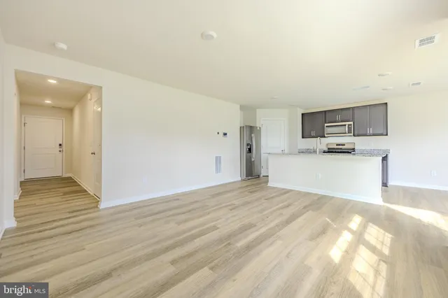 a view of kitchen with wooden floor