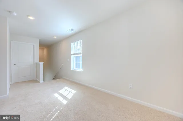 an empty room with windows and yard