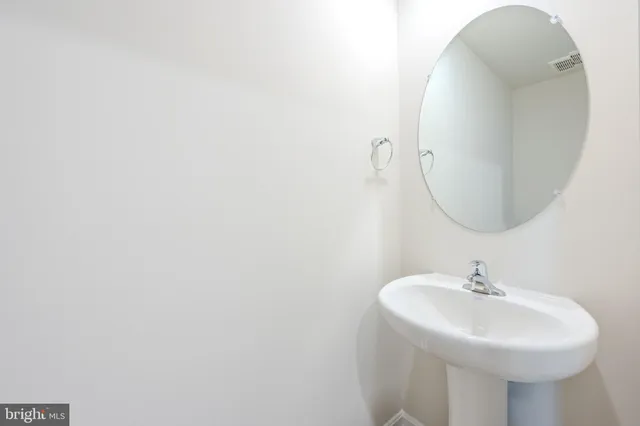 a sink with a mirror