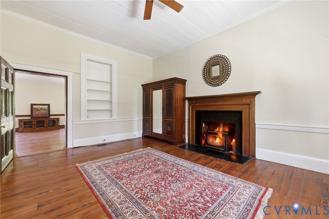 3355 Duke Road Powhatan, VA 23139 - Photo 25 of 67 a living room with furniture and a fireplace