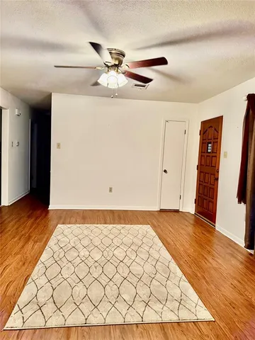 a view of a livingroom with wooden floor