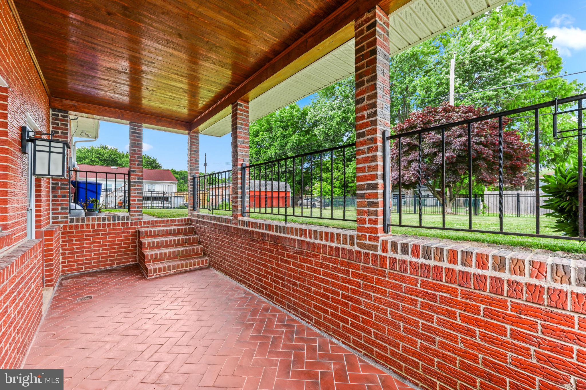 2902 Ritchie Avenue Baltimore, MD 21219 - Photo 37 of 43 a view of a porch with wooden floor and fence