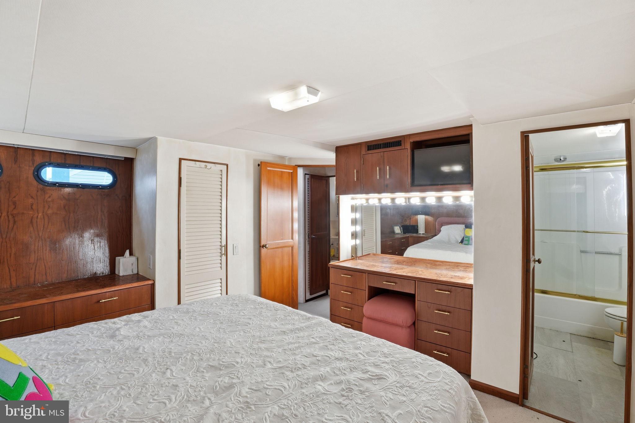 650 Wharf Street Southwest, Unit X48 Washington, DC 20024 - Photo 16 of 42 a bedroom with a bed and a bathroom