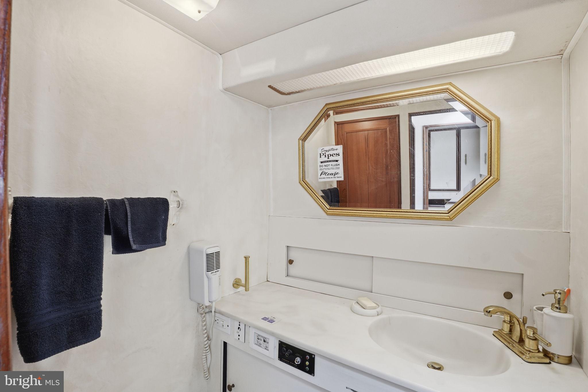 650 Wharf Street Southwest, Unit X48 Washington, DC 20024 - Photo 19 of 42 a bathroom with a sink and a mirror