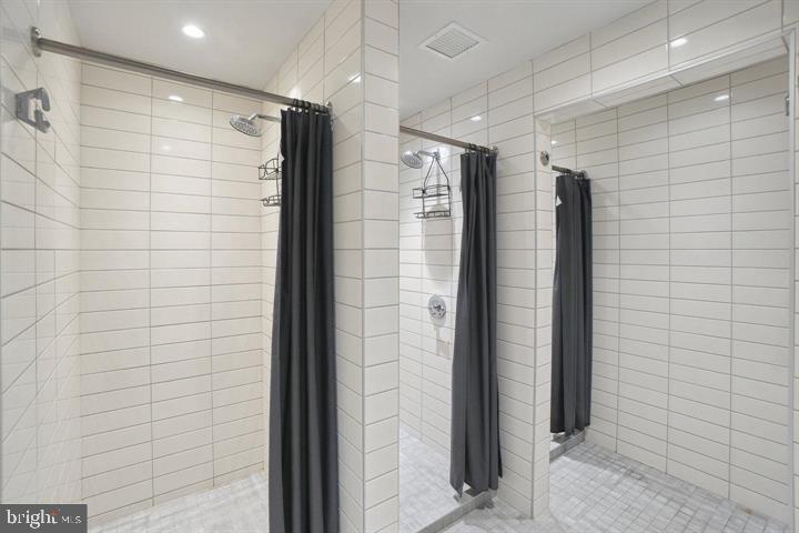 650 Wharf Street Southwest, Unit X48 Washington, DC 20024 - Photo 36 of 42 a bathroom with a shower and a glass door
