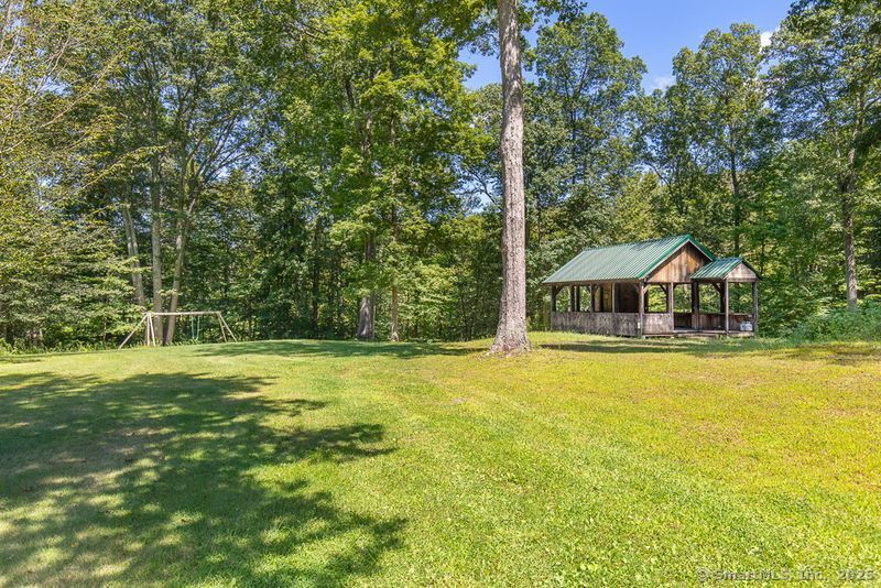 208 Woodcreek Road Bethlehem, CT 06751 - Photo 21 of 29 a house with swimming pool in front of it