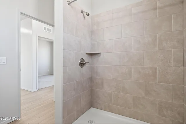 a bathroom with a granite countertop sink a toilet and a mirror