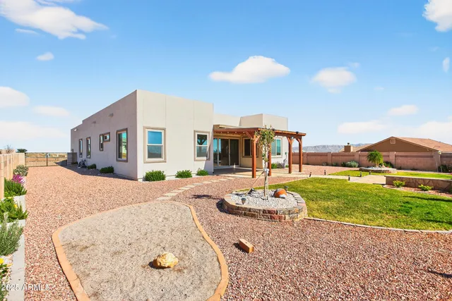 a view of a swimming pool with a yard