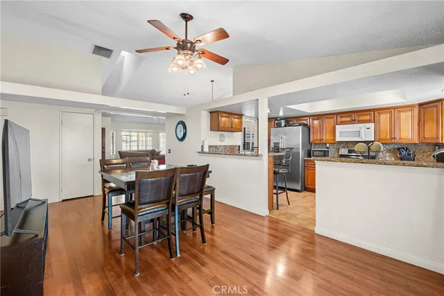 a view of a dining room with furniture and wooden floor