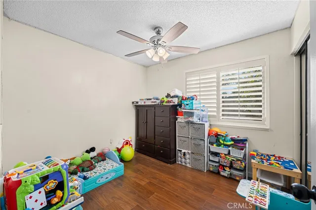 a play room with toys and a wooden floor