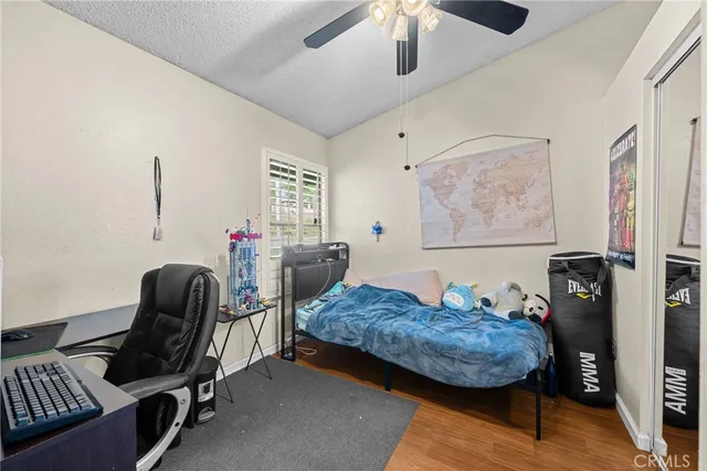 a bedroom with furniture and a window