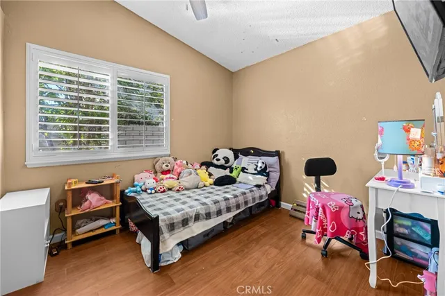 a bedroom with bed and a window