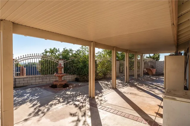 a view of a patio with a table chairs and a table
