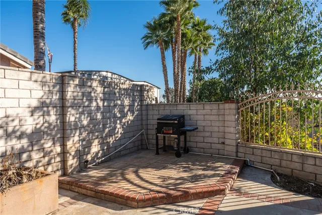 a view of a chairs and table in the patio