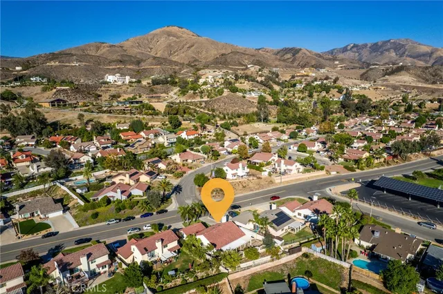 an aerial view of residential houses and outdoor space