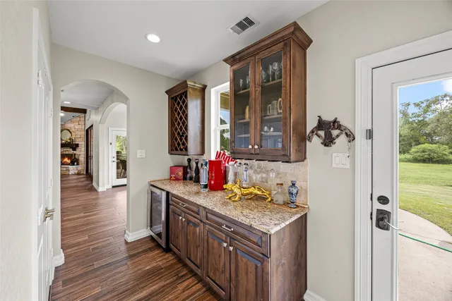 a kitchen with stainless steel appliances granite countertop a stove and a refrigerator