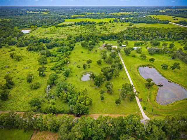 a picture of a utility room with a window and refrigerator