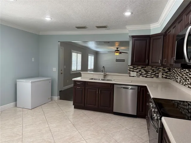 a spacious bathroom with a sink a mirror and a bathtub