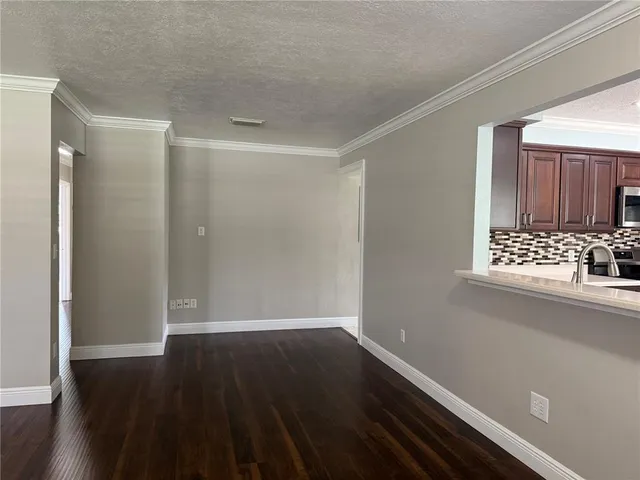 a view of wooden floor in an empty room
