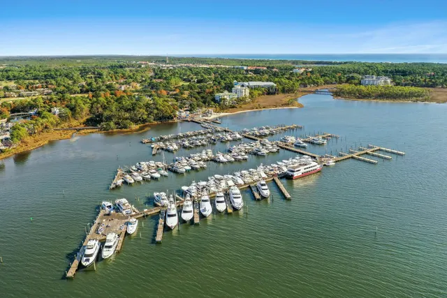 a backyard of a house with lots of green space and lake view
