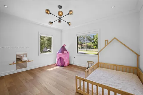 a bedroom with furniture and window