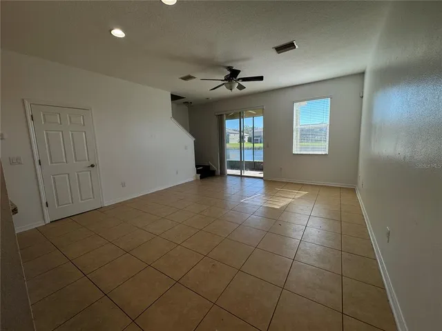 a kitchen with kitchen island a sink stainless steel appliances and cabinets