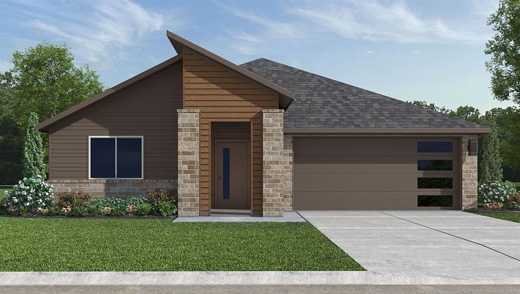 2216 Redwing Drive Denton, TX 76205 - Photo 1 of 1 a front view of a house with a garage