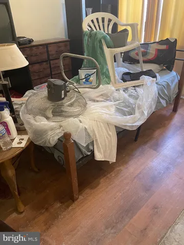 a room with washing machine and cabinets