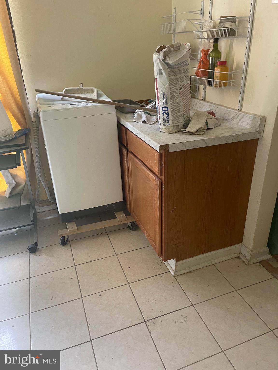 7985 Riggs Road, Unit 1 Hyattsville, MD 20783 - Photo 14 of 25 a room with washing machine and cabinets