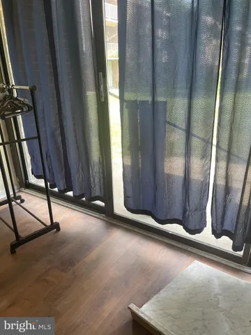 a kitchen with washing machine and cabinets