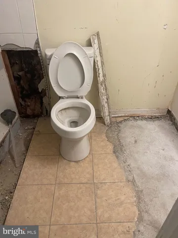 a bathroom with a toilet and a sink