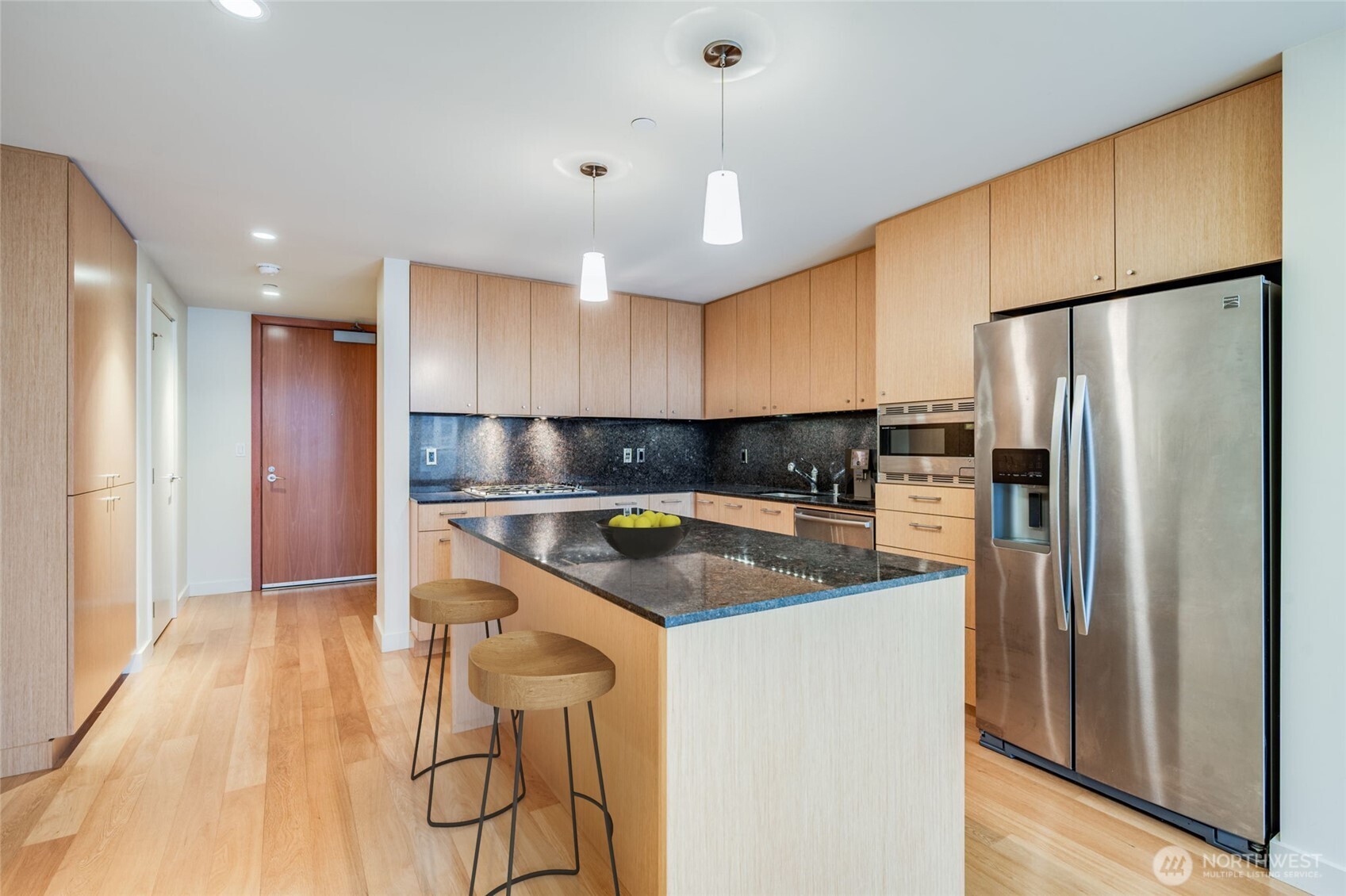 909 5th Avenue, Unit 1203 Seattle, WA 98164 - Photo 15 of 32 a kitchen with stainless steel appliances granite countertop a refrigerator a sink and a stove