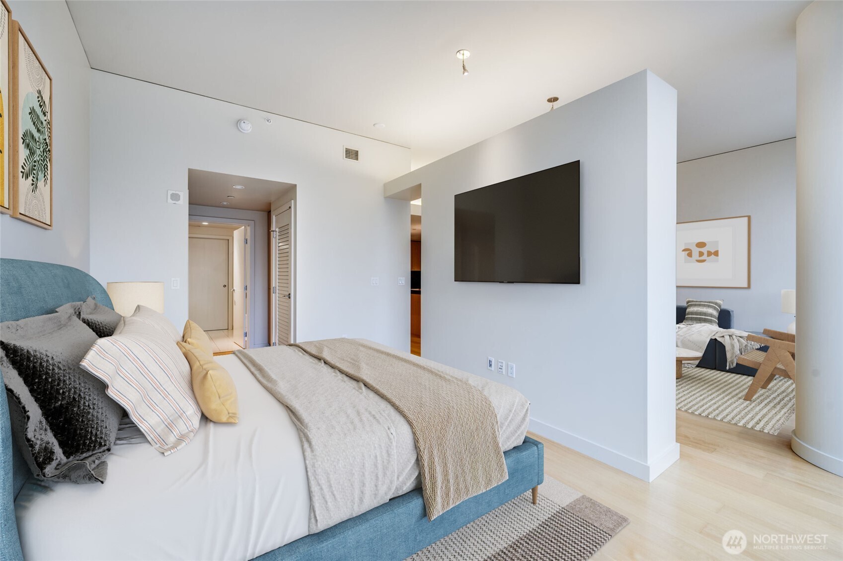 909 5th Avenue, Unit 1203 Seattle, WA 98164 - Photo 20 of 32 a bedroom with a bed and a flat screen tv