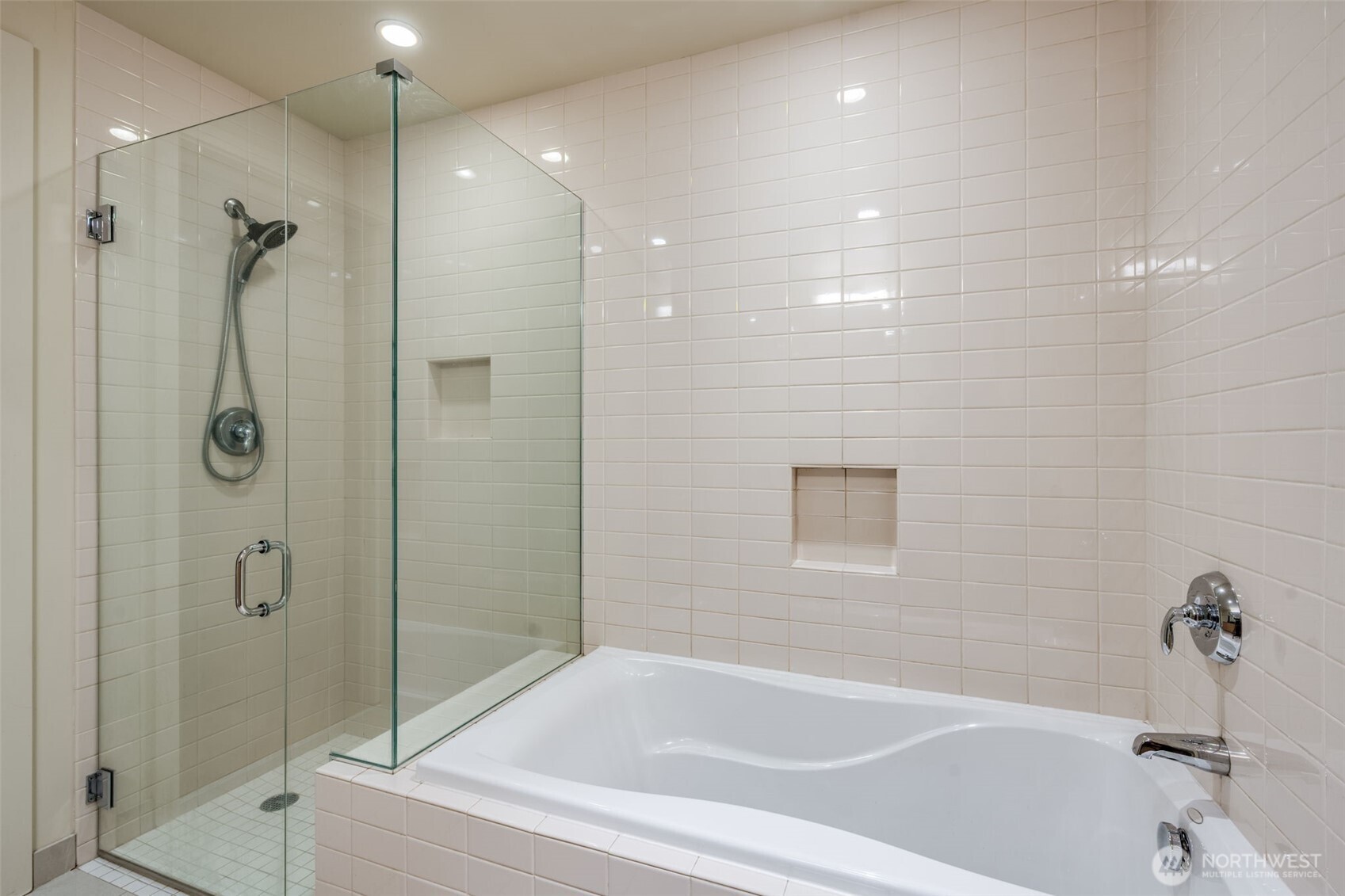 909 5th Avenue, Unit 1203 Seattle, WA 98164 - Photo 24 of 32 a bathroom with a bathtub and a shower