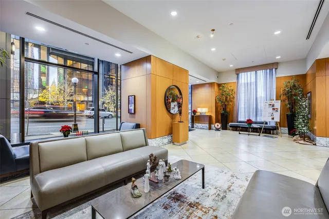 a living room with furniture and a large window