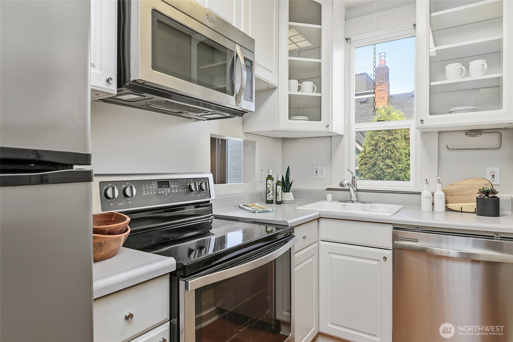 3624 Whitman Avenue North, Unit 4 Seattle, WA 98103 - Photo 12 of 39 a kitchen with a stove and a microwave