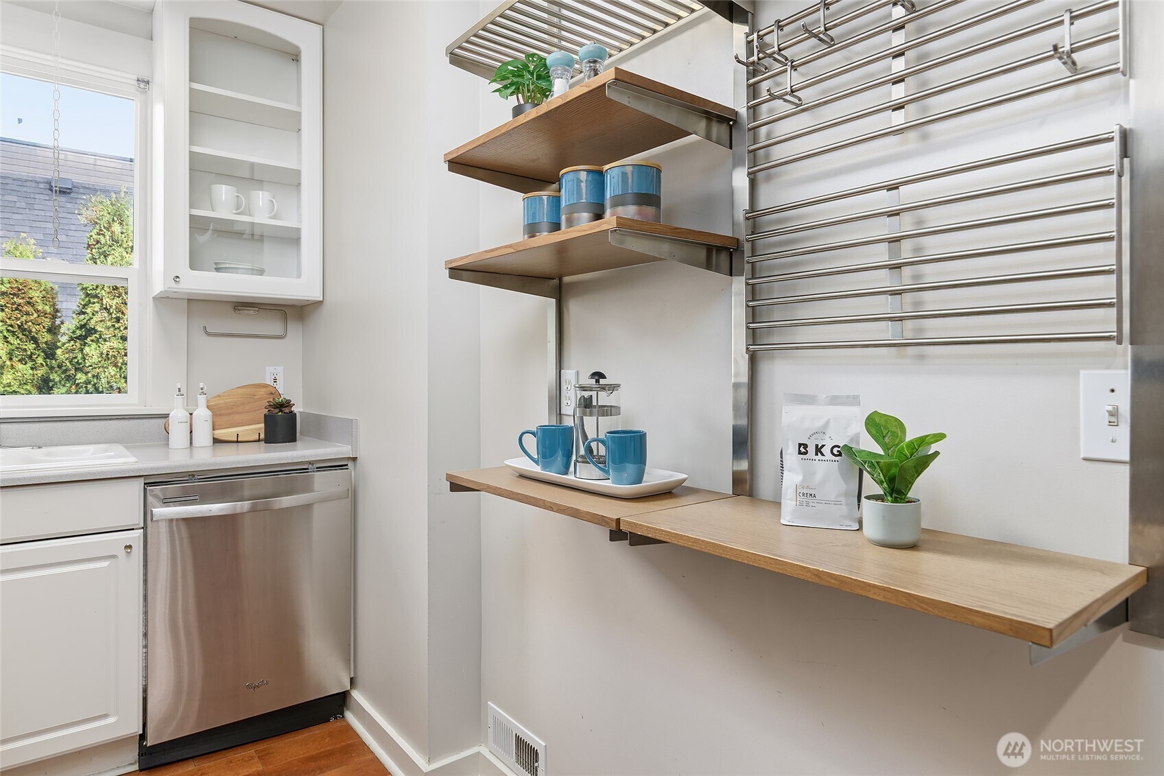 3624 Whitman Avenue North, Unit 4 Seattle, WA 98103 - Photo 13 of 39 a kitchen with a refrigerator and a sink