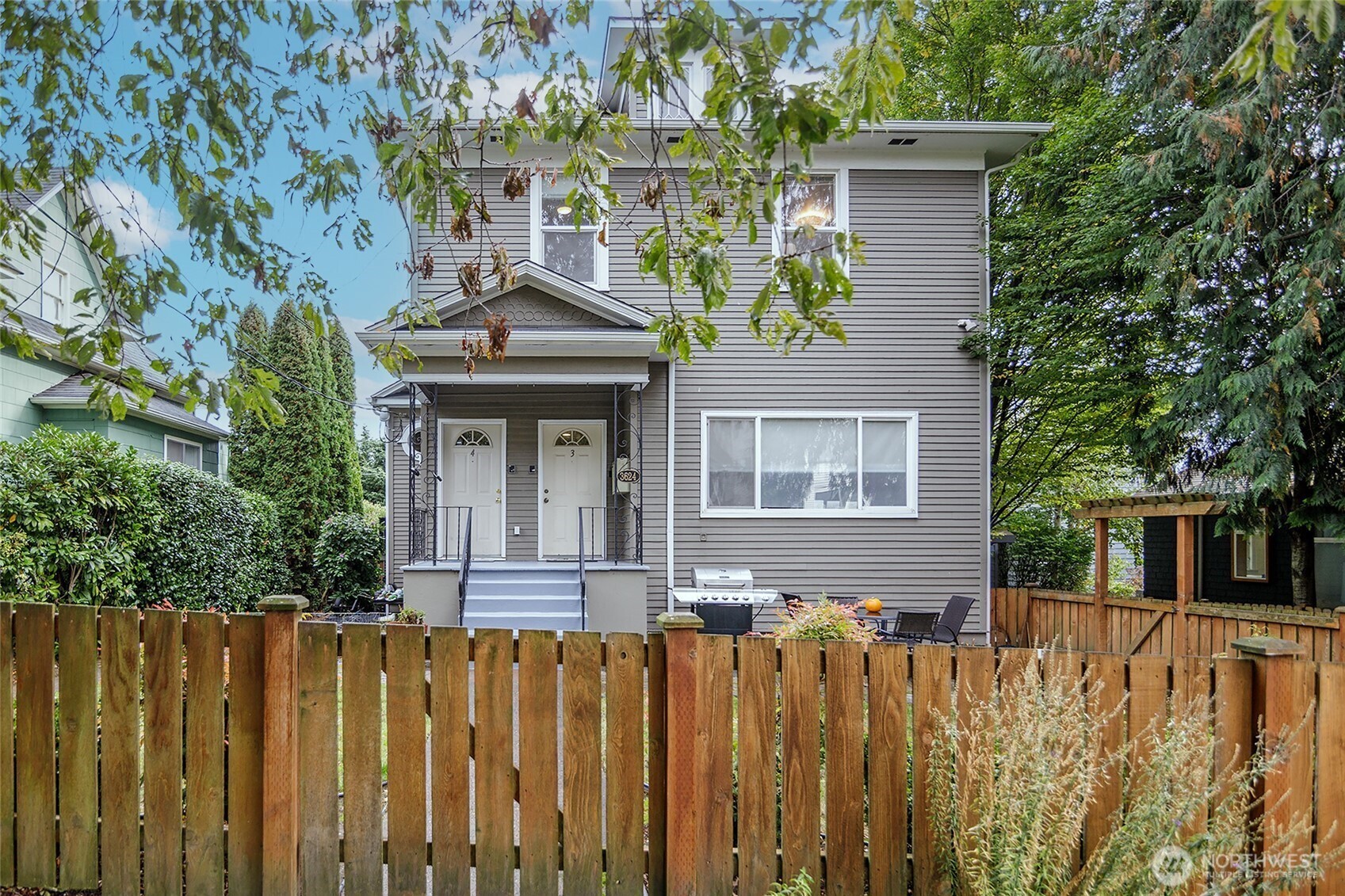 3624 Whitman Avenue North, Unit 4 Seattle, WA 98103 - Photo 2 of 39 a front view of a house with a garden