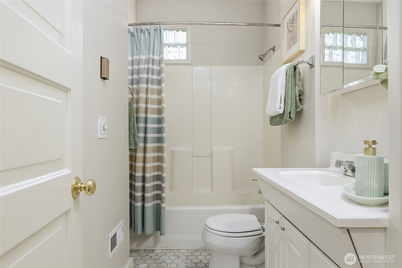 3624 Whitman Avenue North, Unit 4 Seattle, WA 98103 - Photo 24 of 39 a bathroom with a sink toilet and shower
