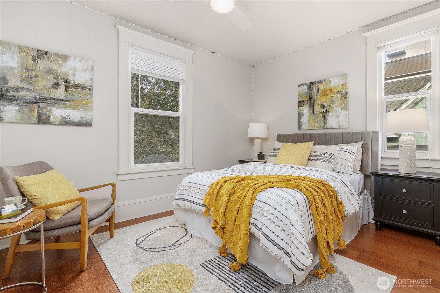 3624 Whitman Avenue North, Unit 4 Seattle, WA 98103 - Photo 25 of 39 a bedroom with a bed and chair