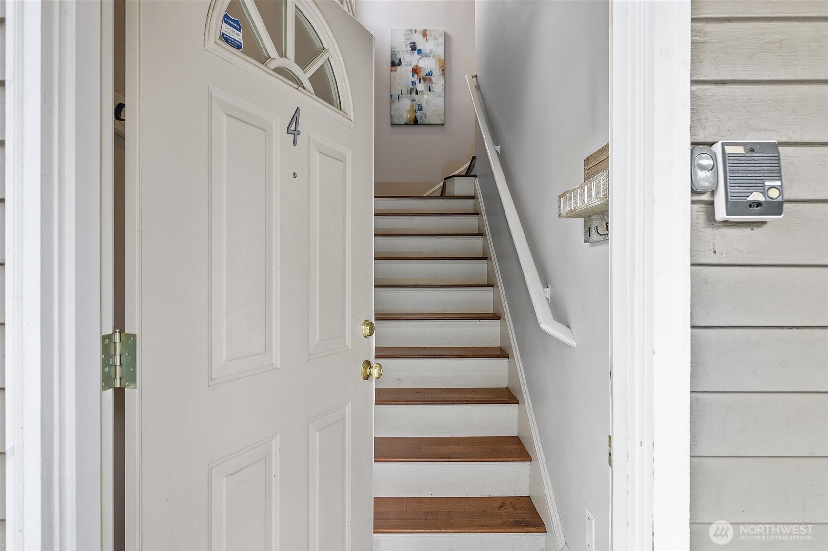 3624 Whitman Avenue North, Unit 4 Seattle, WA 98103 - Photo 3 of 39 a view of a hallway with wooden floor and entryway