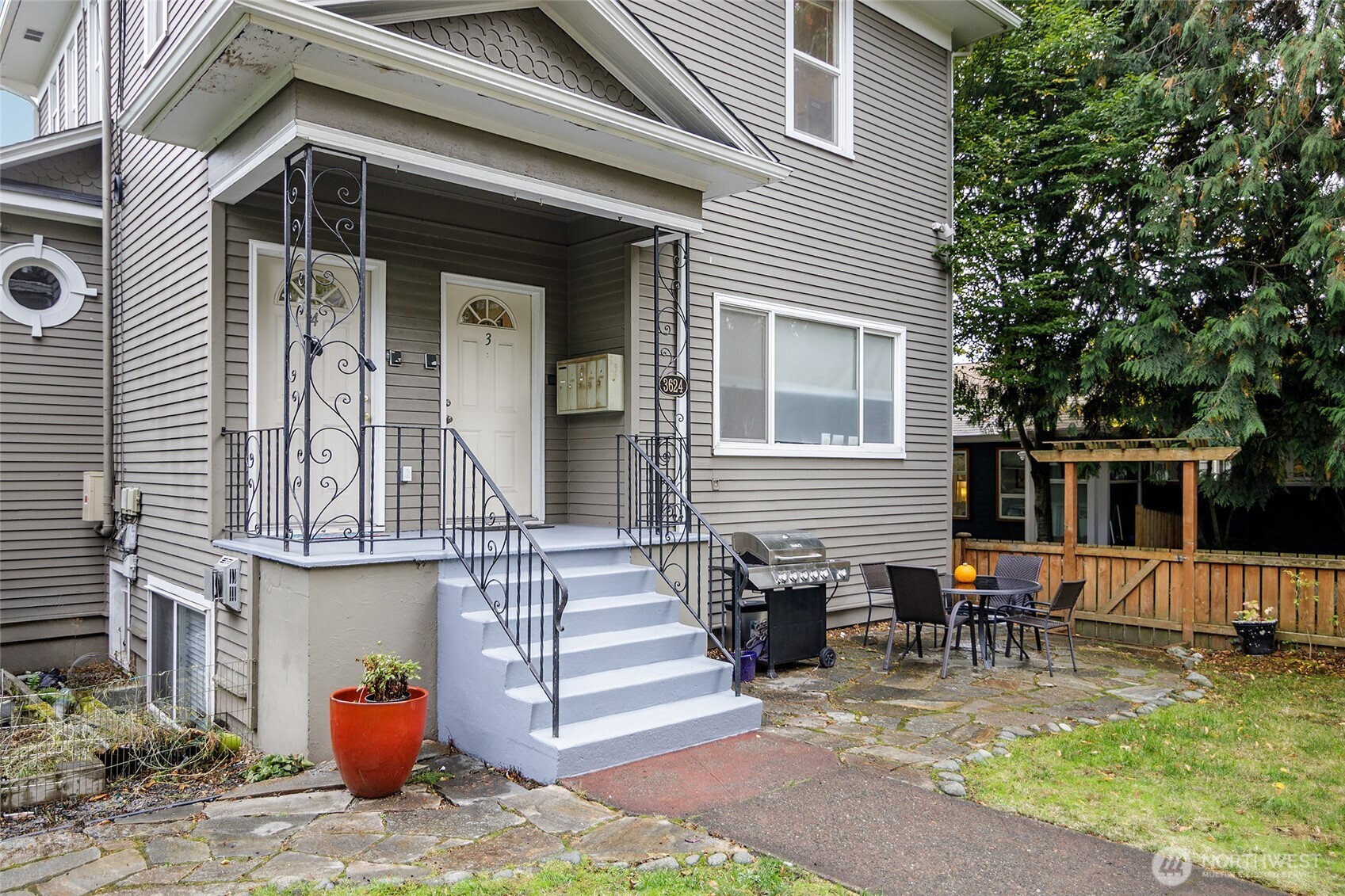 3624 Whitman Avenue North, Unit 4 Seattle, WA 98103 - Photo 39 of 39 a backyard of a house with seating space
