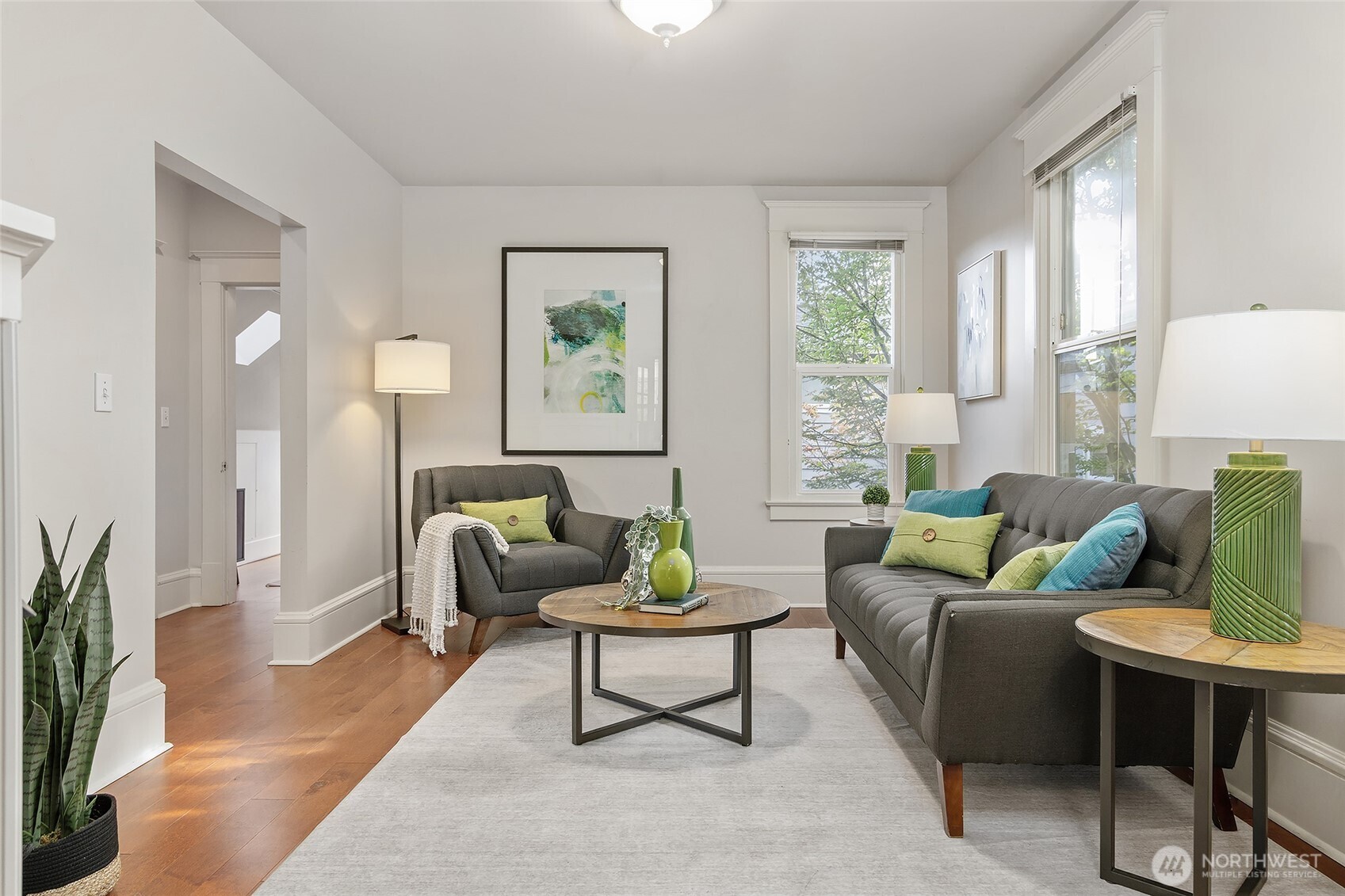 3624 Whitman Avenue North, Unit 4 Seattle, WA 98103 - Photo 4 of 39 a living room with furniture and a potted plant