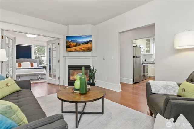 a living room with furniture and a fireplace