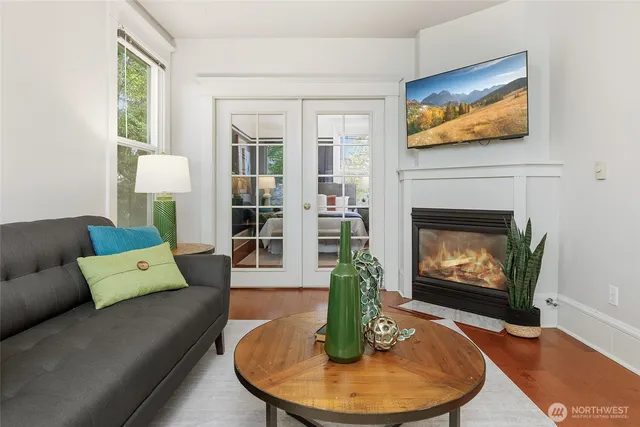 a living room with furniture and a fireplace