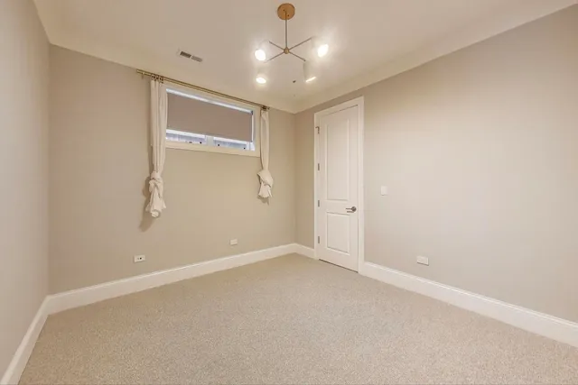 an empty room with an empty space and a ceiling fan